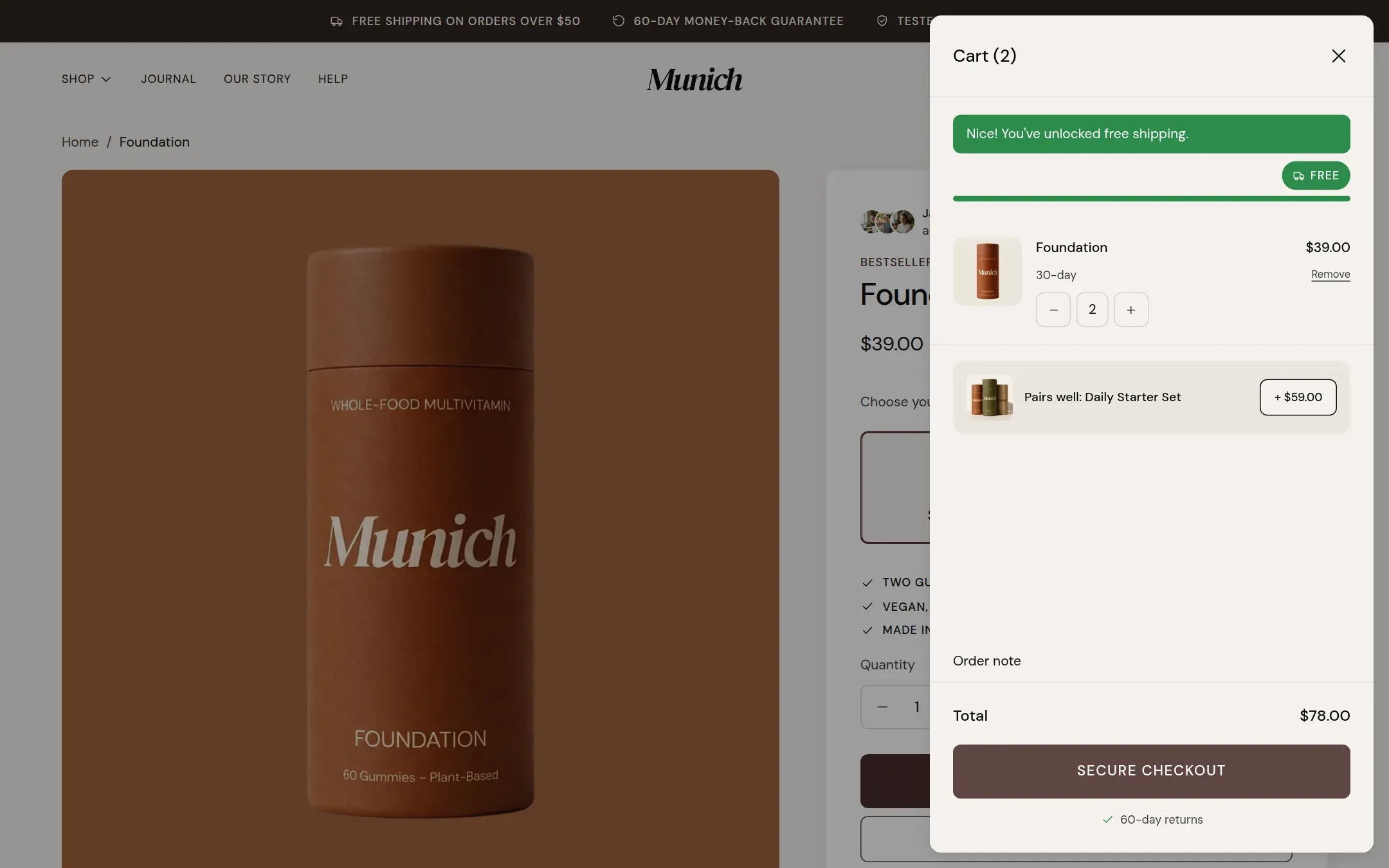 The cart drawer open over the product page, with the free shipping bar and the upsell line.