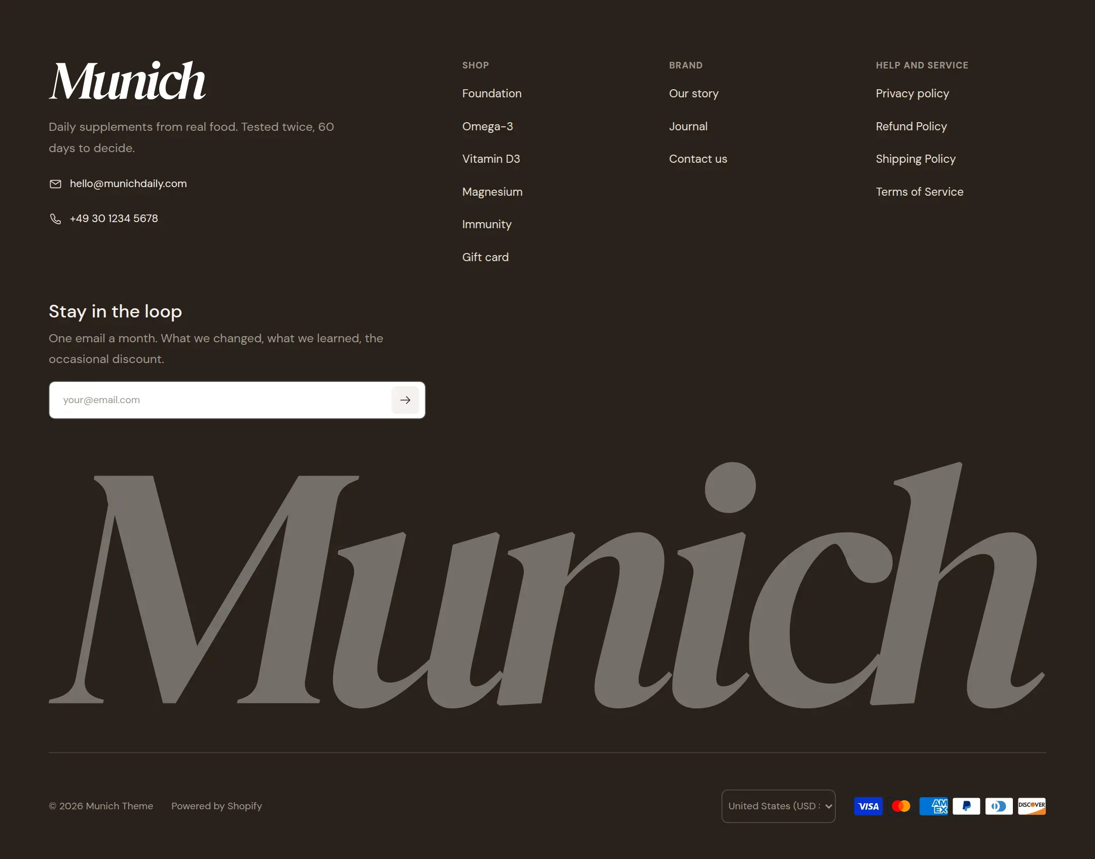 The footer on desktop with four columns and the large wordmark below.